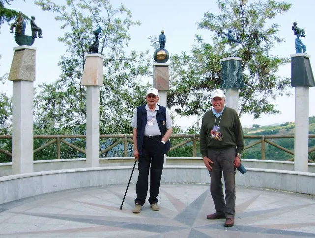 Veterans Bernard Collier and Mick Wagner at a memorial during the 2003 trail