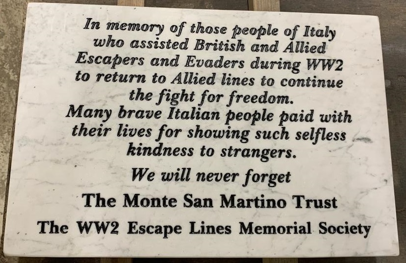 Plaque on the memorial to the helpers of Italy