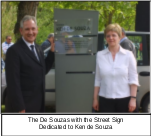 The de Souzas with the street sign dedicated to Ken de Souza