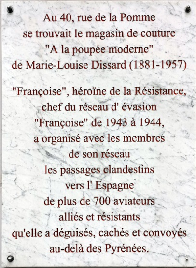 Plaque at Marie-Louise Dissard's former shop on rue de la Pomme