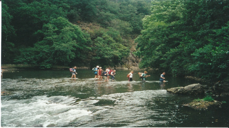 Walkers wading the River Bidassoa