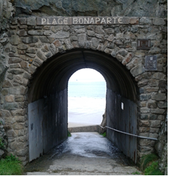 Tunnel leading through the cliffs to Plage Bonaparte