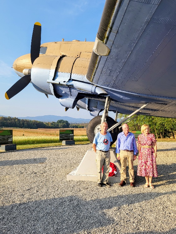 ELMS members standing beneath the Dakota memorial aircraft
